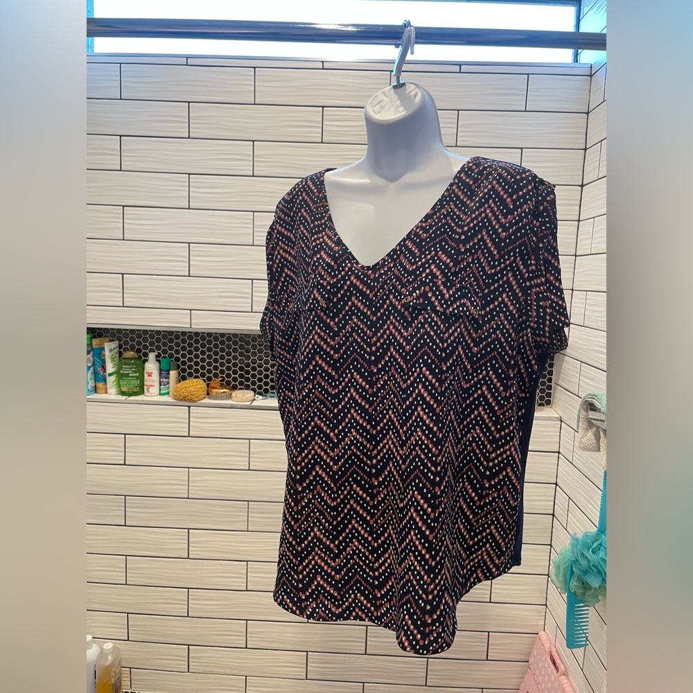 Polka dot blouse.